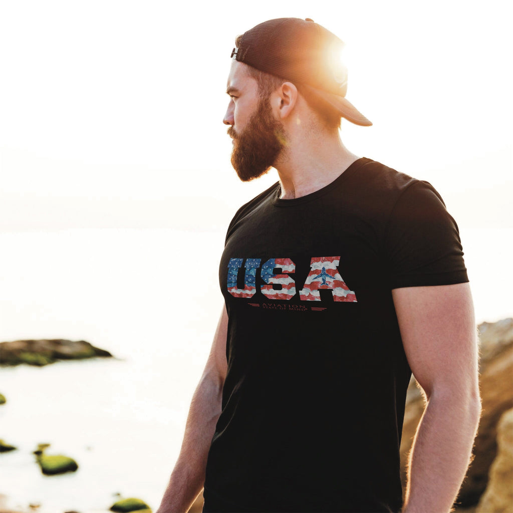 guy wearing pilot t-shirt in black with use flag