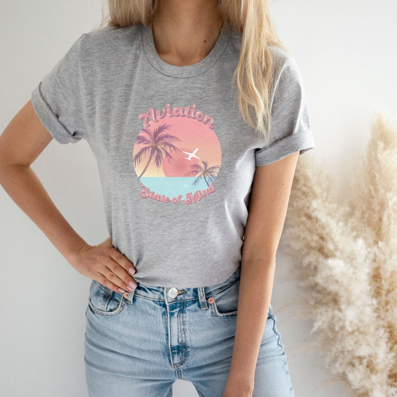 girl w gray airplane tshirt with sunset